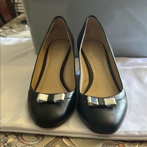 Coach Black Heels with Sleek Design and Metallic Accent